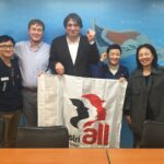 IndustriALL assistant general secretary and others with Sister Lee