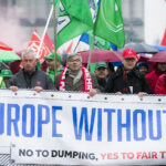 IndustriALL and IG Metall President, Jörg Hofmann (centre with scarf) marches with industriAll Europe's general secretary Luc Triangle (Second left). 