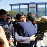 Brother Han welcomed by comrades outside the prison gates