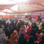 Survivors and families affected by the Ali Enterprises fire meet at a rally on the second anniversary of the fire. 