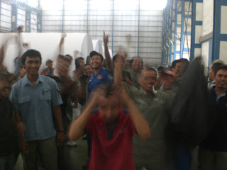 Indonesian paper workers celebrating victory