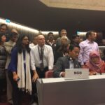Asbestos victim, Siti Kristina (bottom right), is supported by campaigners as she makes her speech to the Rotterdam Convention plenary. 3 May 2017