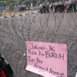 Barbed-wire barricades used to block protestors.