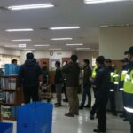 Police raid KMWU offices in Korea.