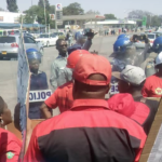 Police surround the ZCTU headquarters in Harare.