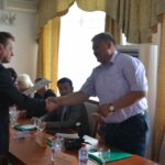 Sergius Glovackas, ILO, hands out the certificates of the workshop