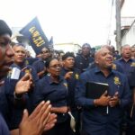 Workers outside the Ministry of Labour in Trinidad before the agreement to secure a pay increase was made. Photo: OWTU