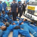 Workers blocked the vehicle moving